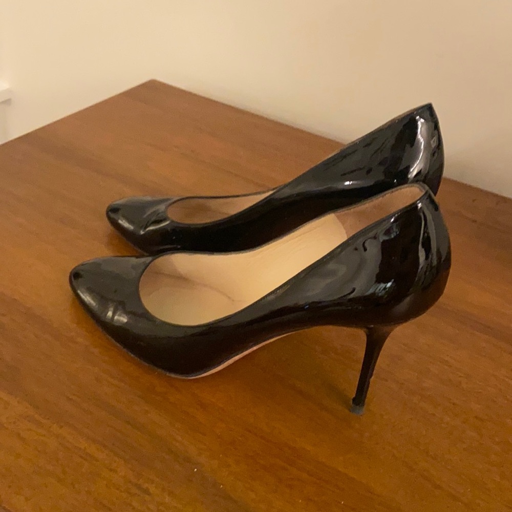 Black patent leather Jimmy Choo pumps